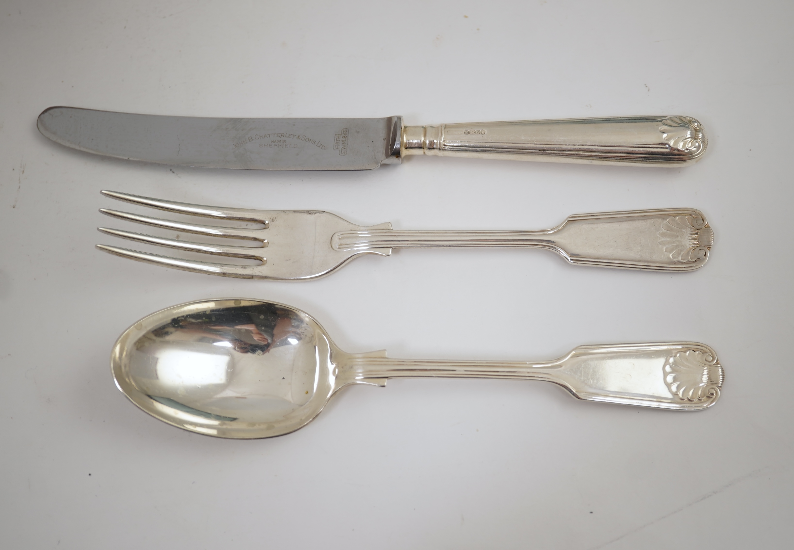 An Elizabeth II part canteen of silver fiddle, thread and shell pattern cutlery, by J B Chatterley & Sons Ltd